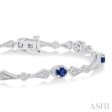 1 10 ctw Oval Cut 4X3MM Sapphire and Round Cut Diamond Precious Bracelet in 10K White Gold For Sale