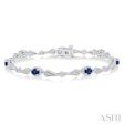 1 10 ctw Oval Cut 4X3MM Sapphire and Round Cut Diamond Precious Bracelet in 10K White Gold For Sale