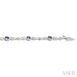 1 10 ctw Oval Cut 4X3MM Sapphire and Round Cut Diamond Precious Bracelet in 10K White Gold For Sale